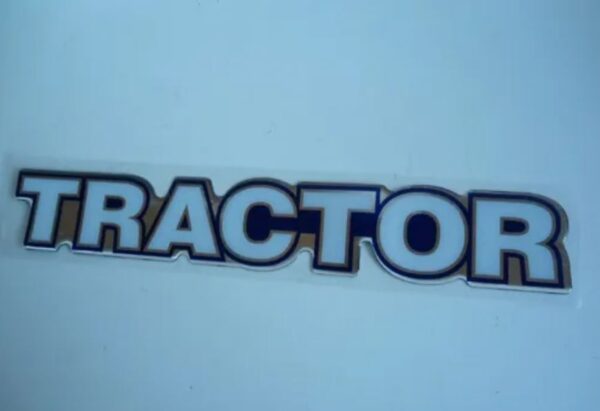 PL0684 - EMBLEMA RESINADO VW TRACTOR AZUL